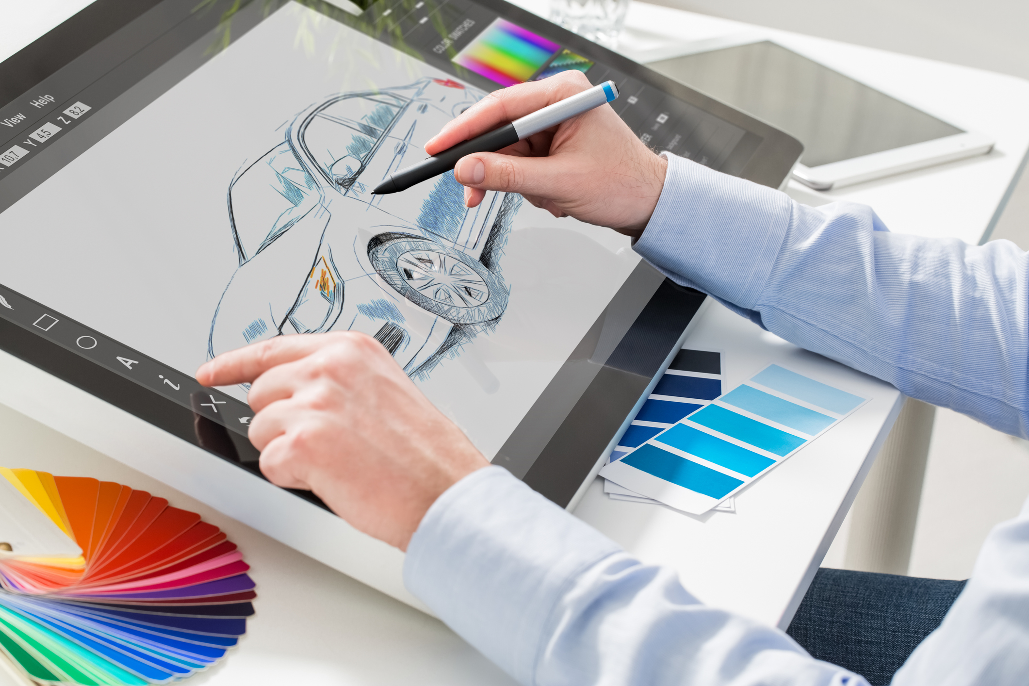 Graphic designer drawing a car