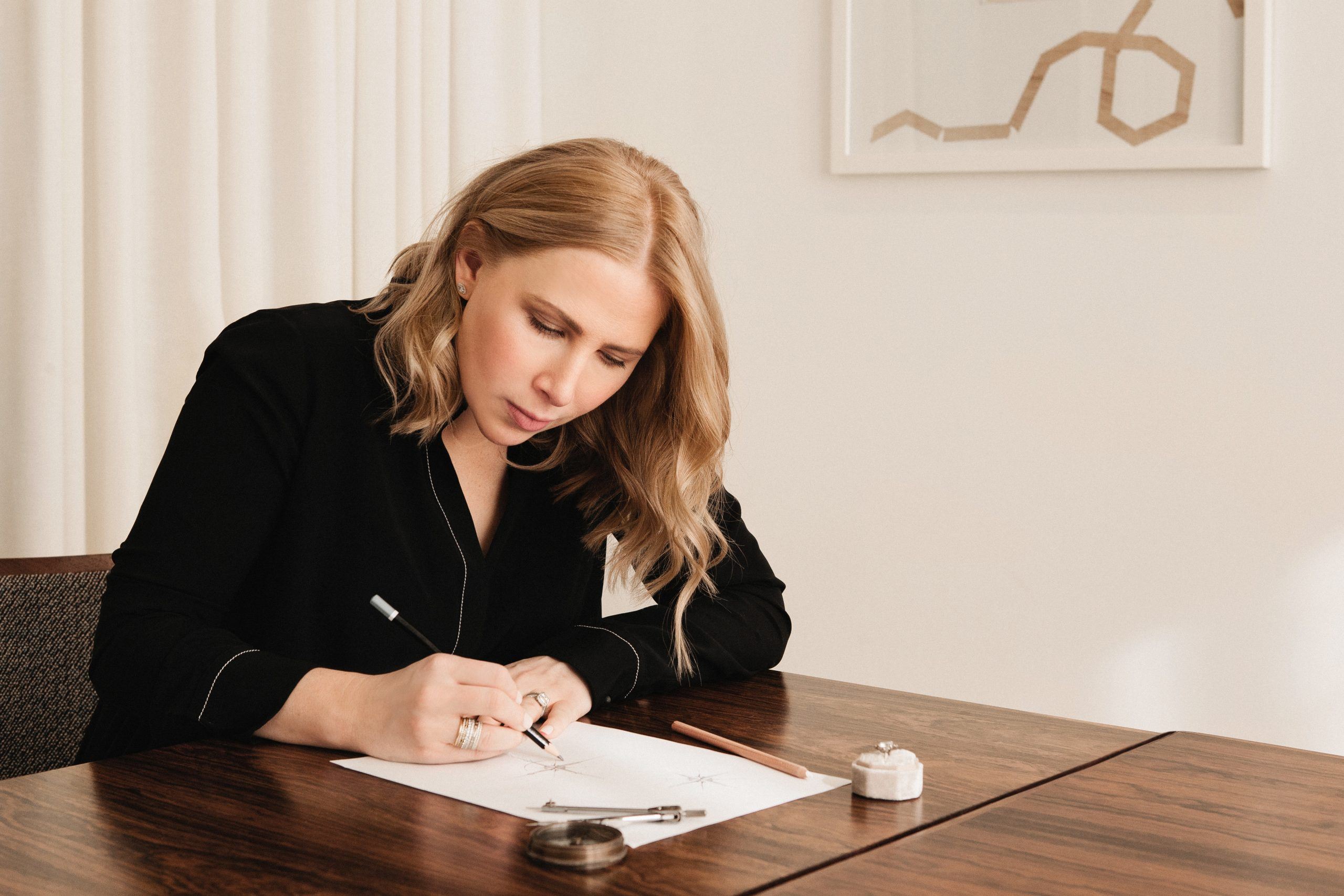 Jewelry Designer Susie Salzman sketching on paper