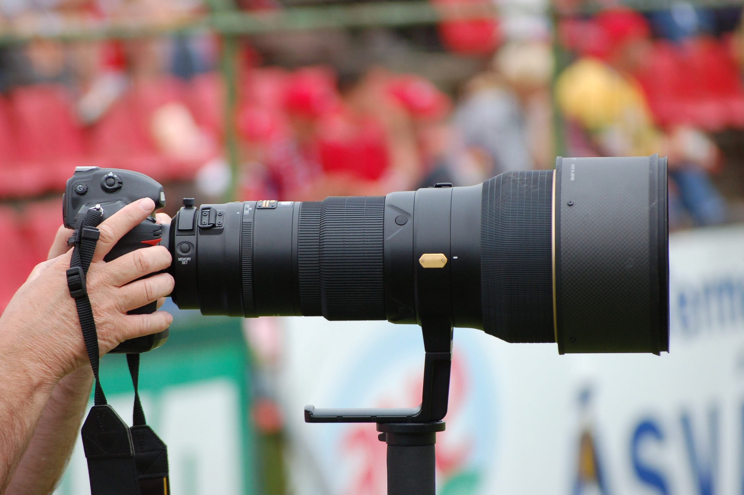 Professional Camera man taking a picture of a sporting event
